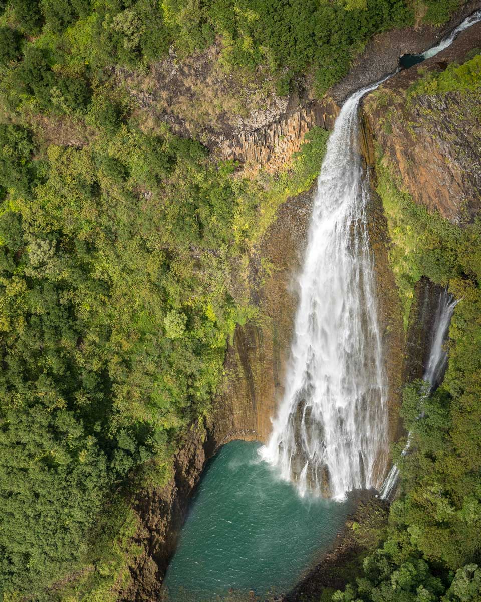 Jurassic Park Falls seen from above on a helicopter tour in Kauai Hawaii