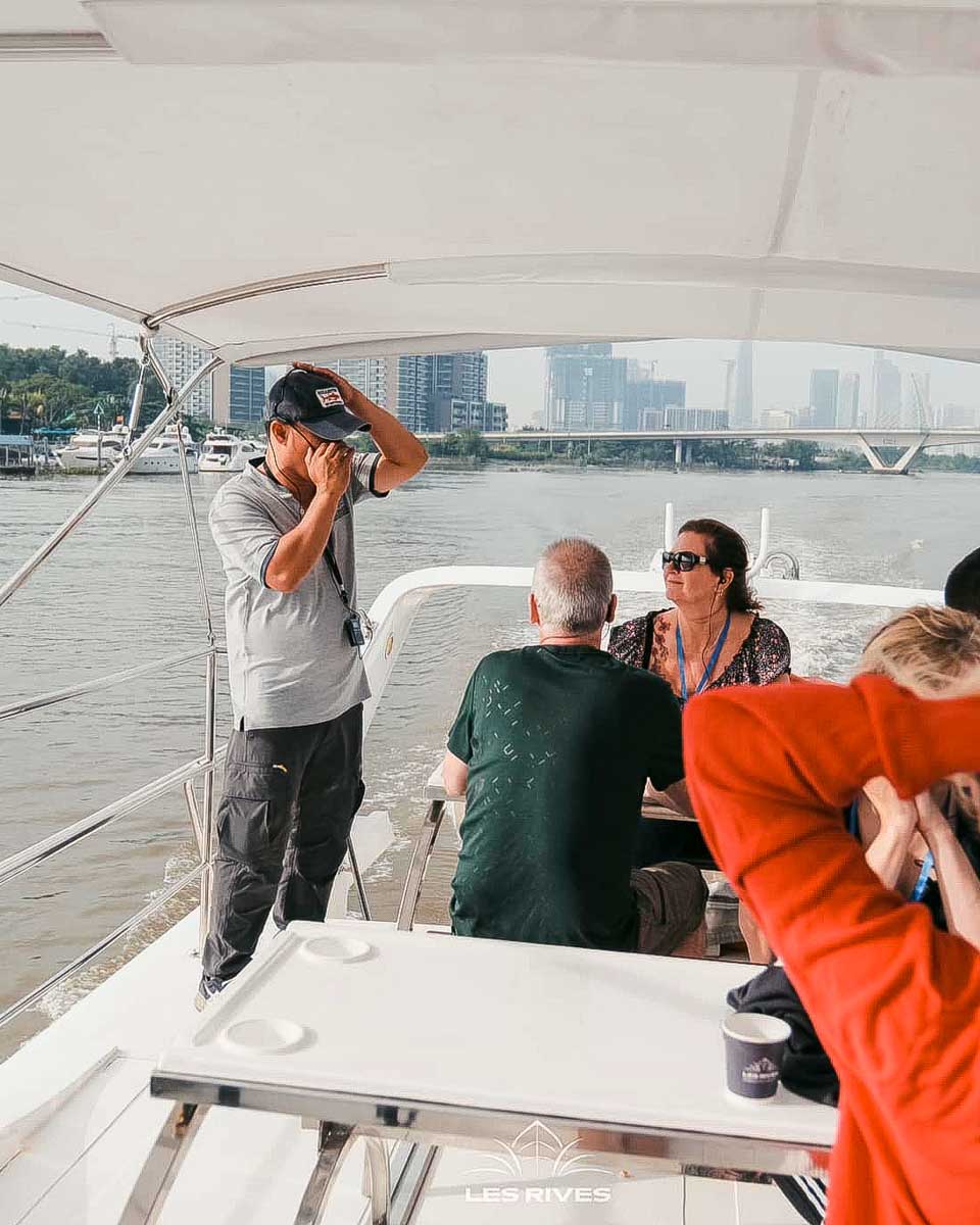 Les Rives Vietnam - Authentic River Experience people ride a speed boat to cu chi tunnels vietnam
