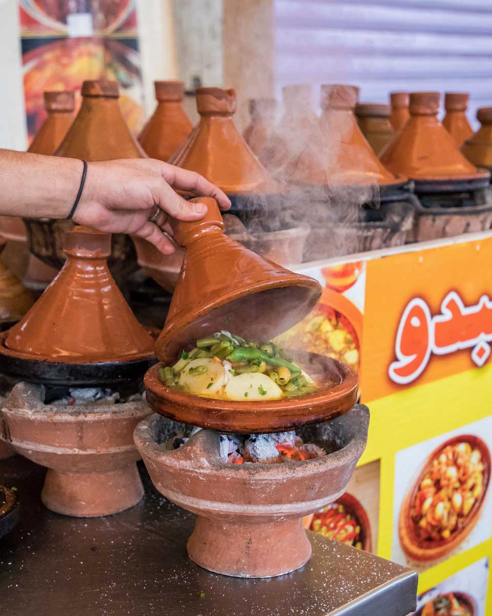 Preparing traditional tagine on a food tour of Marrakech Morocco