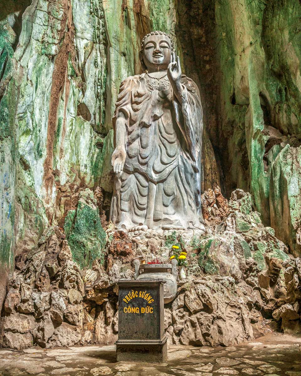 Statue of Buddha in the Marble Mountains on a tour from Hoi An Vietnam