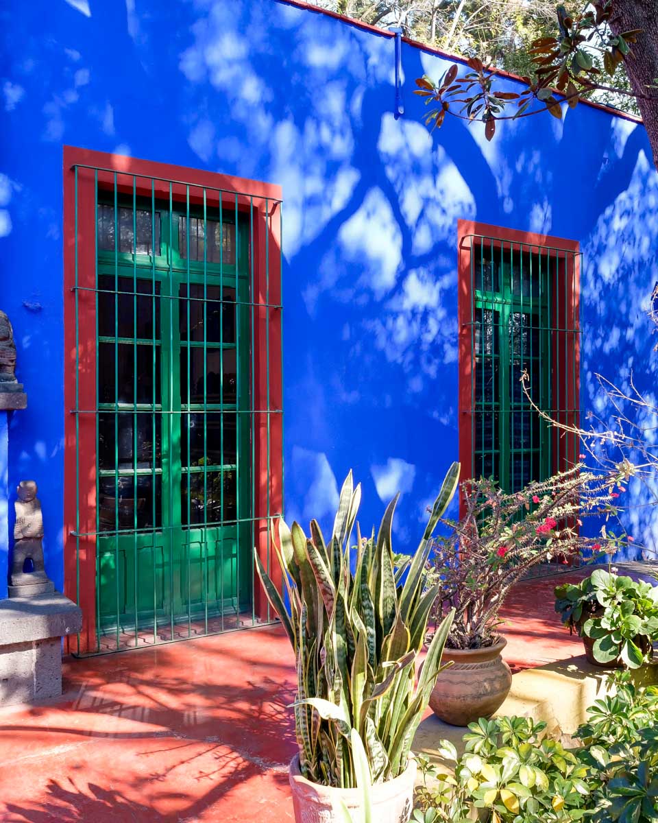 The courtyard and blue house at the Frida Kahlo Museum on a trip from Mexico City Mexico
