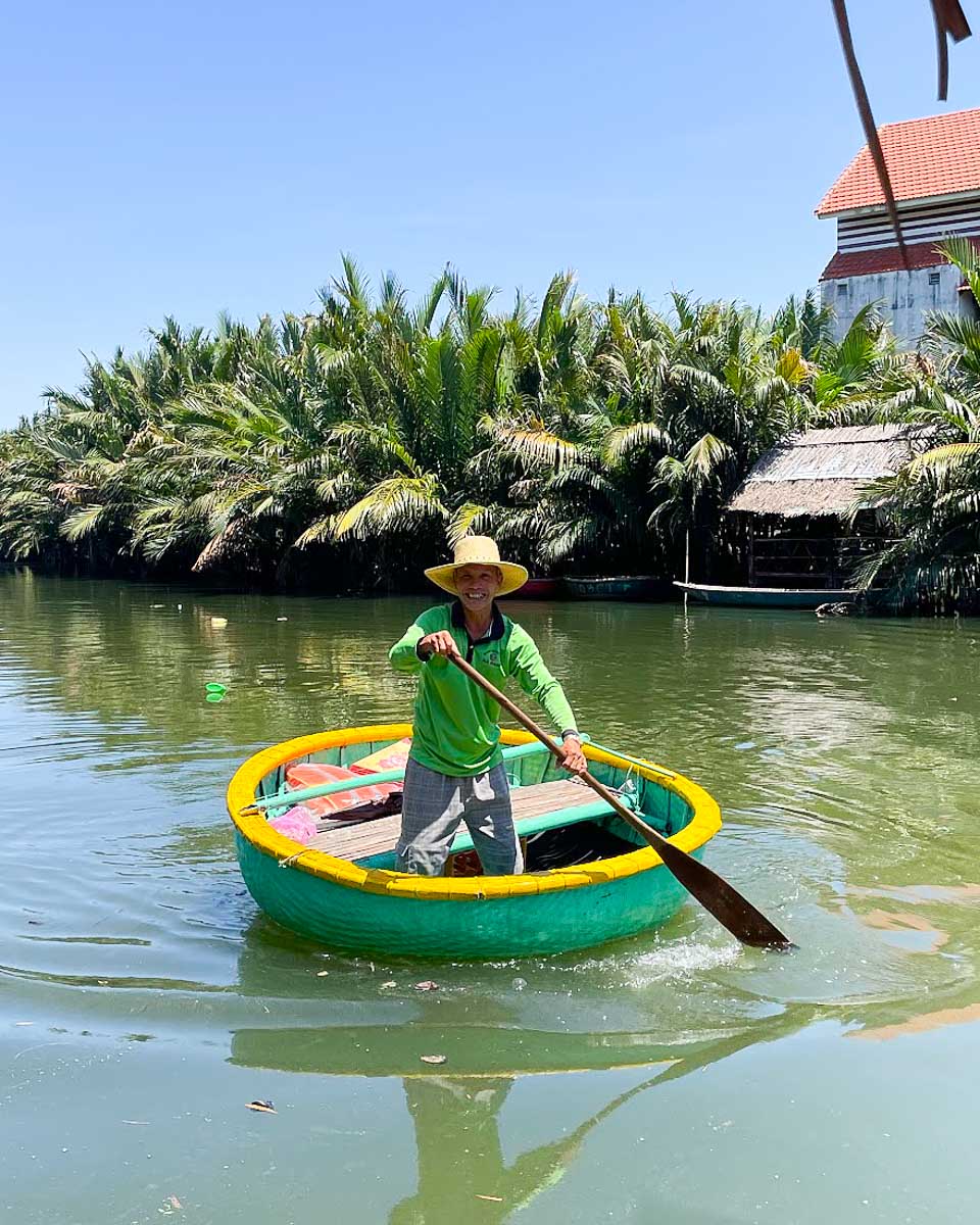 Vietnamese man in a coconut boat on a tour in Hoi An, Vietnam