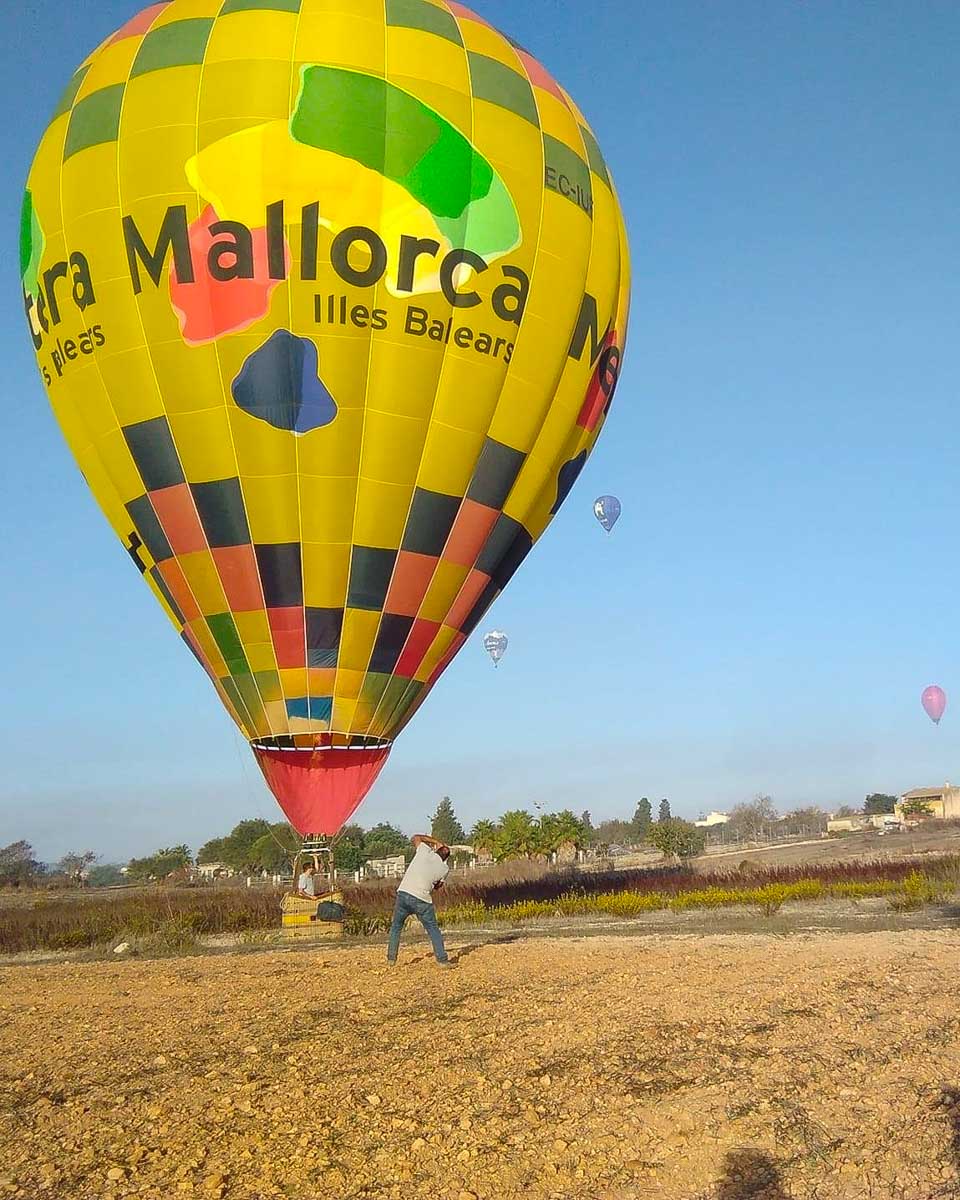 A hot air balloon taking off from the ground in Palma de Mallorca Spain