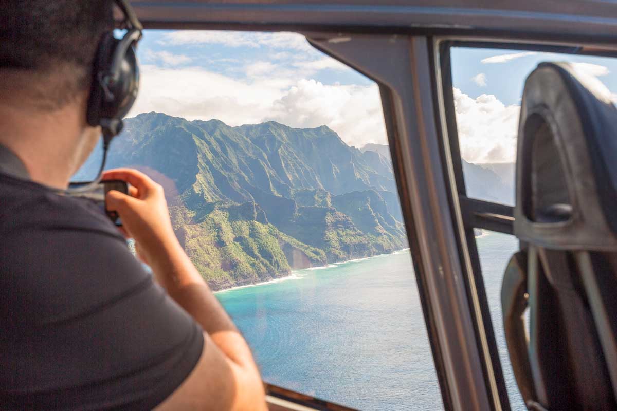 A man in a helicopter on a tour from Kauai Hawaii
