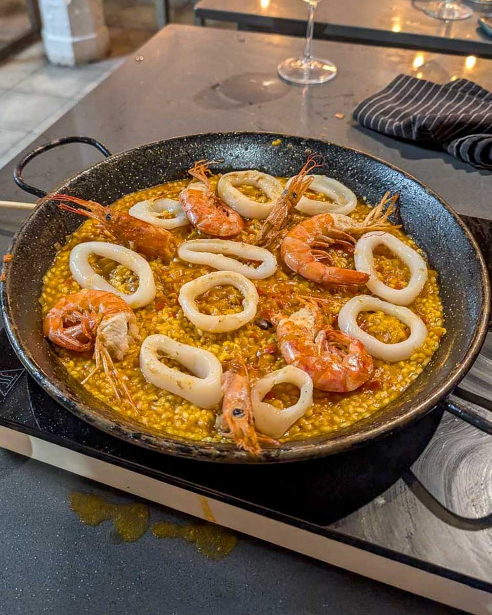 A-pan-with-shrimp-paella-during-a-Paella-making-class-in-Valencia-Spain