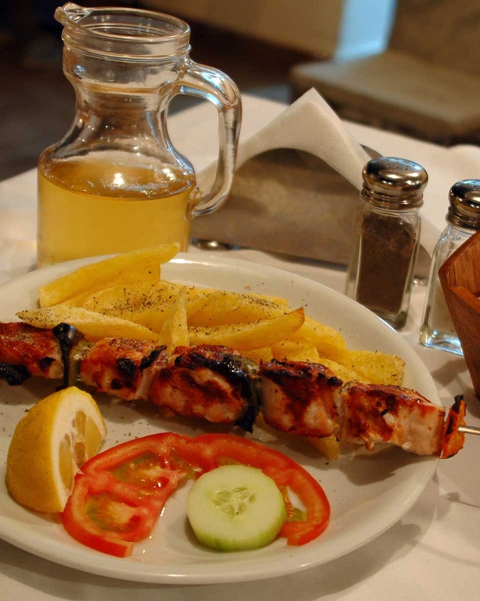 A plate with souvlaki that we tried on a food tour in Santorini Greece
