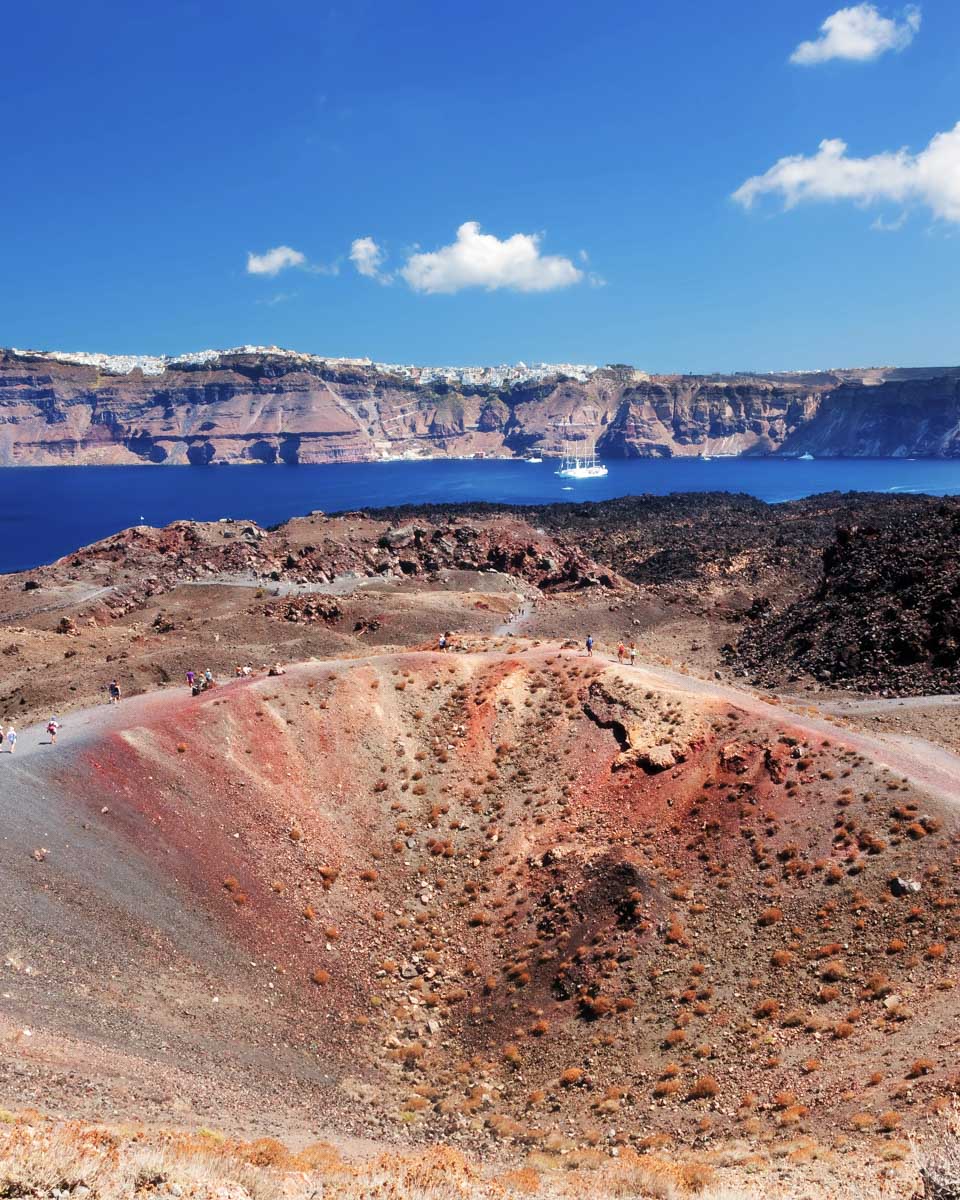 A volcanic crater seen on a hile of Nea Kameni on a tour from Santorini Greece