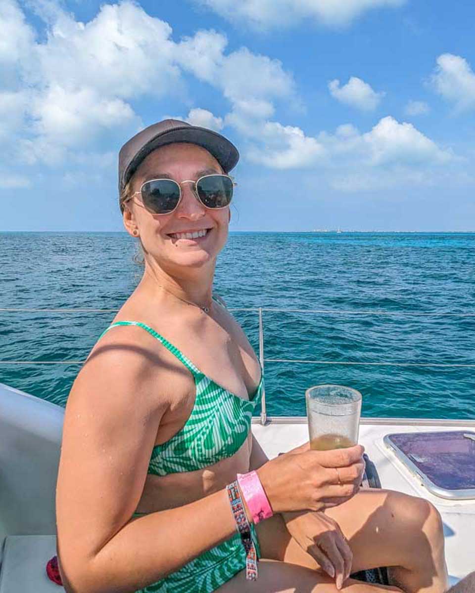 Bailey-relaxes-with-a-drink-on-a-catamaran-cruise-from-Turks and Caicos
