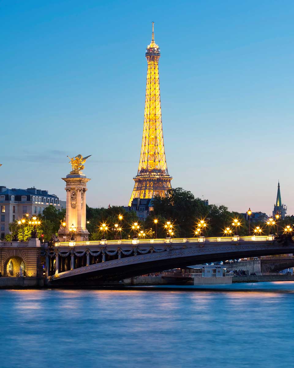Eiffel Tower seen at night from a Seine River Cruise in Paris France