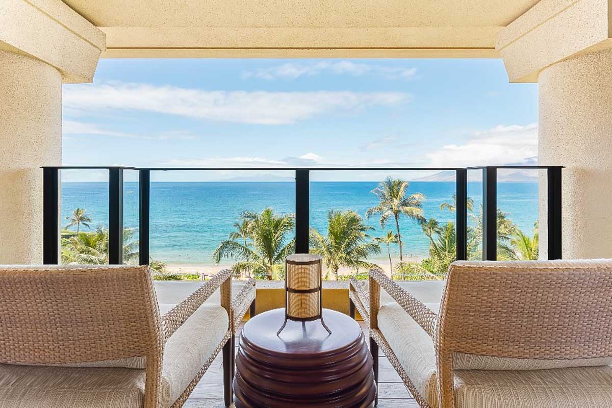Hotel room balcony looking over the ocean at the Four Seasons Resort Hualalai Hawaii