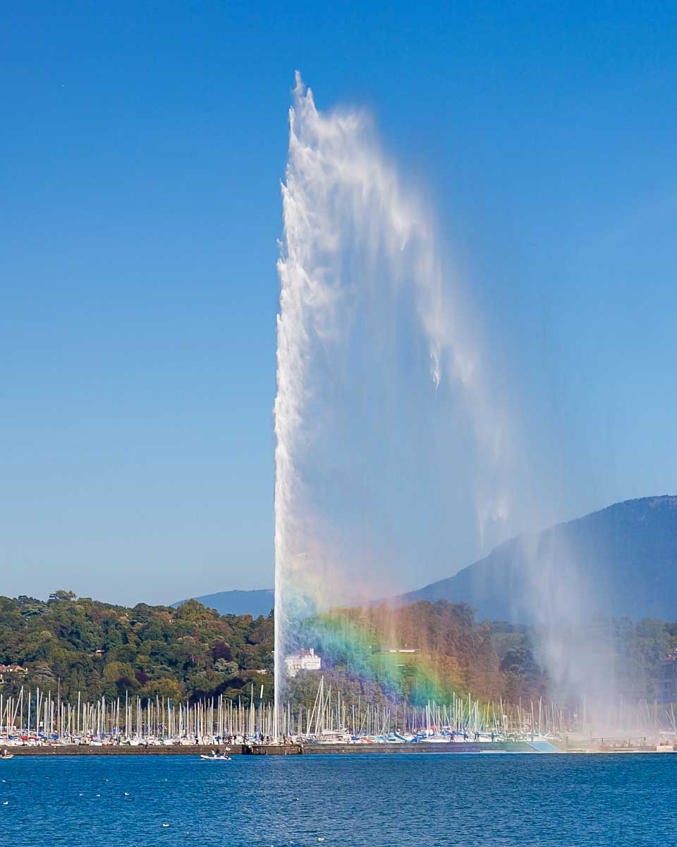 Jet d'Eau fountain in Lake Geneva seen on a boat tour in Geneva Switzerland