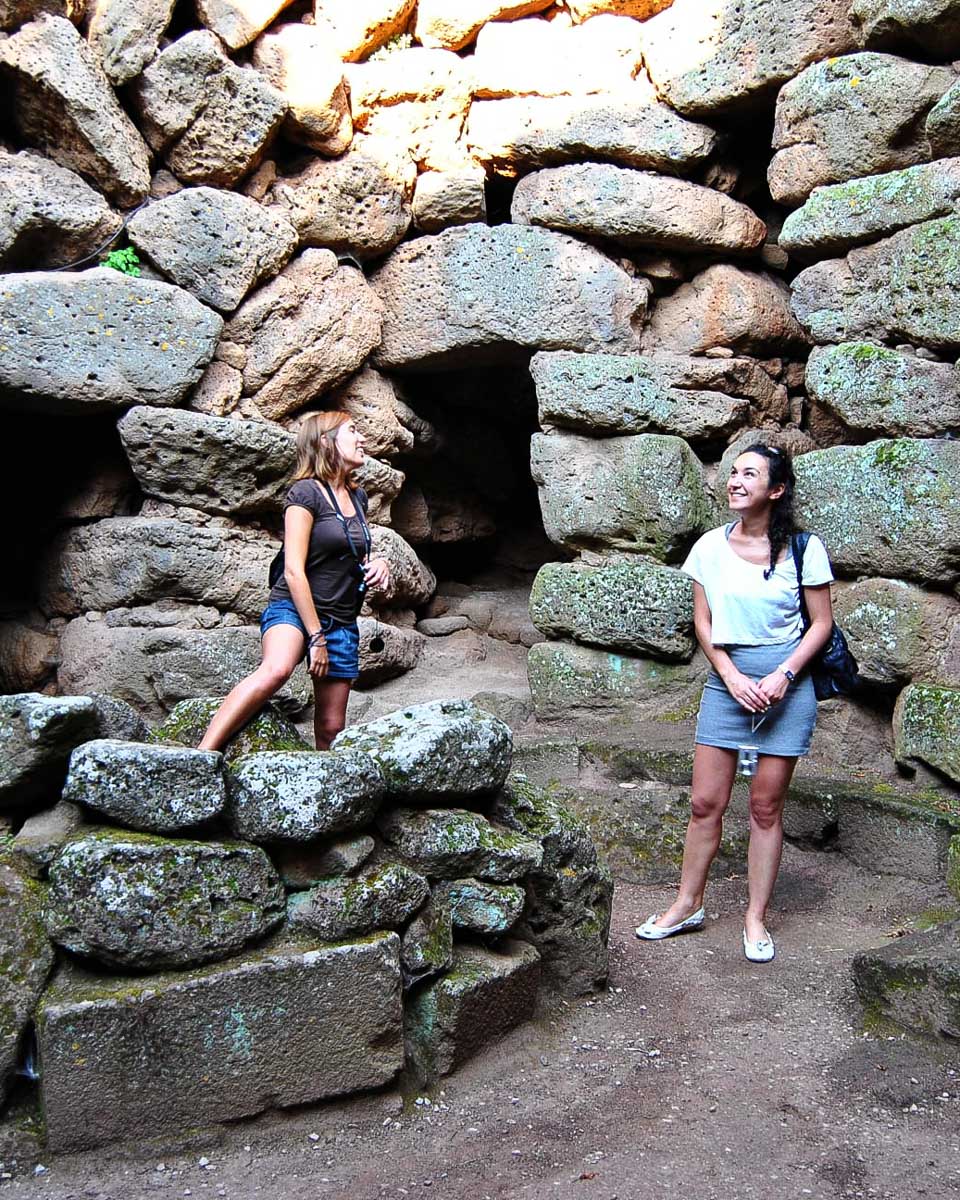 People inside Su Nuraxi on a tour from Cagliari Italy