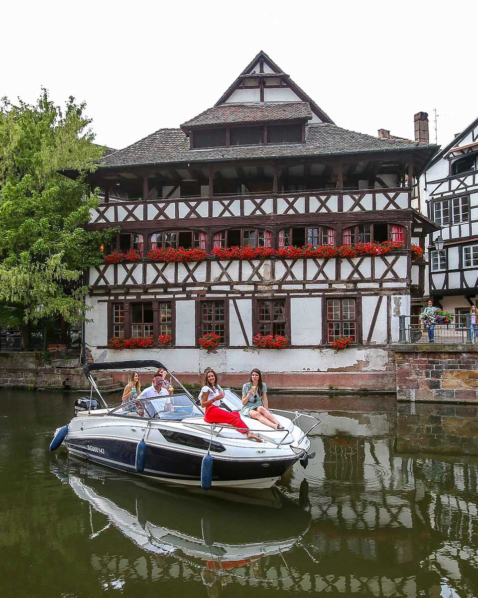 People on a private yacht in the canals on a tour in Strasbourg France