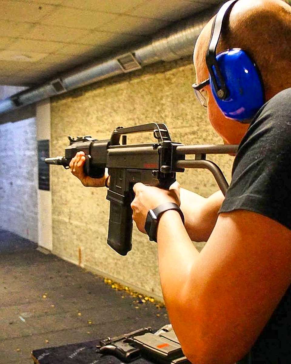 Shooting Range Riga a man fires a rifle on a tour in Riga Latvia