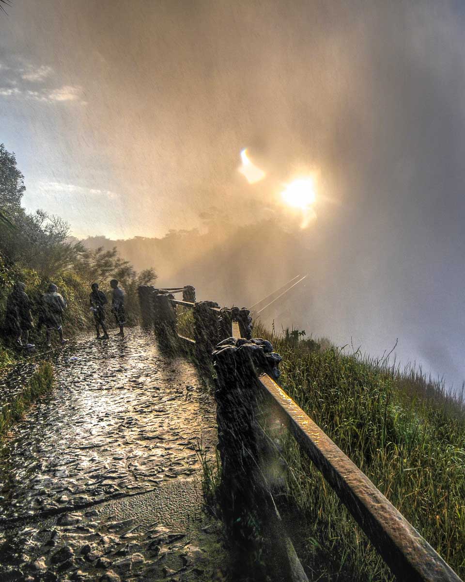 Victoria Falls seen on the walkway with people