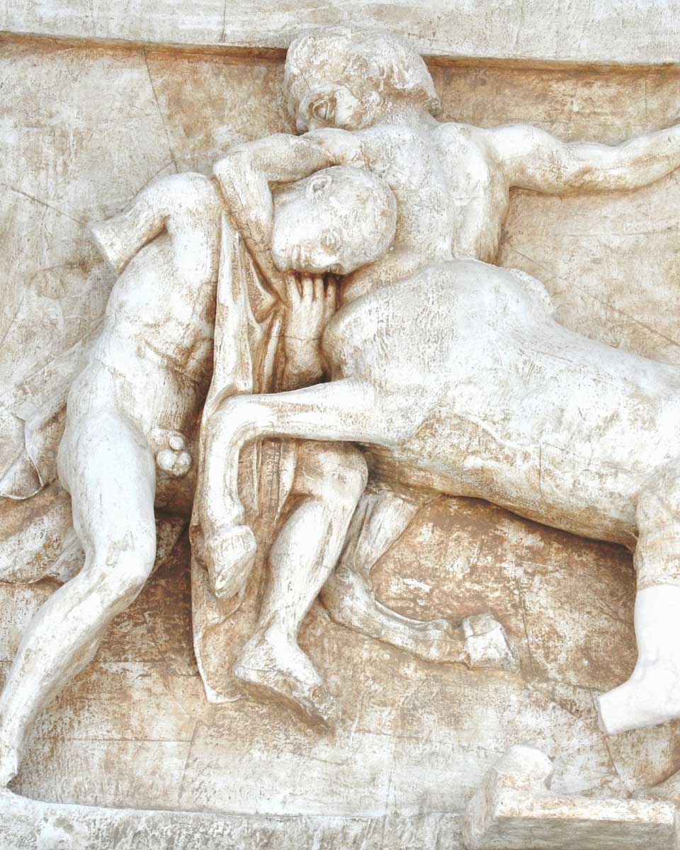 A carving of a battle on one of the ancient metopes in the Acropolis Museum in Athens Greece