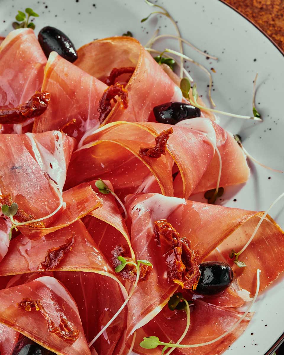 A meat plate with olives eaten on a food tour in Zadar Croatia