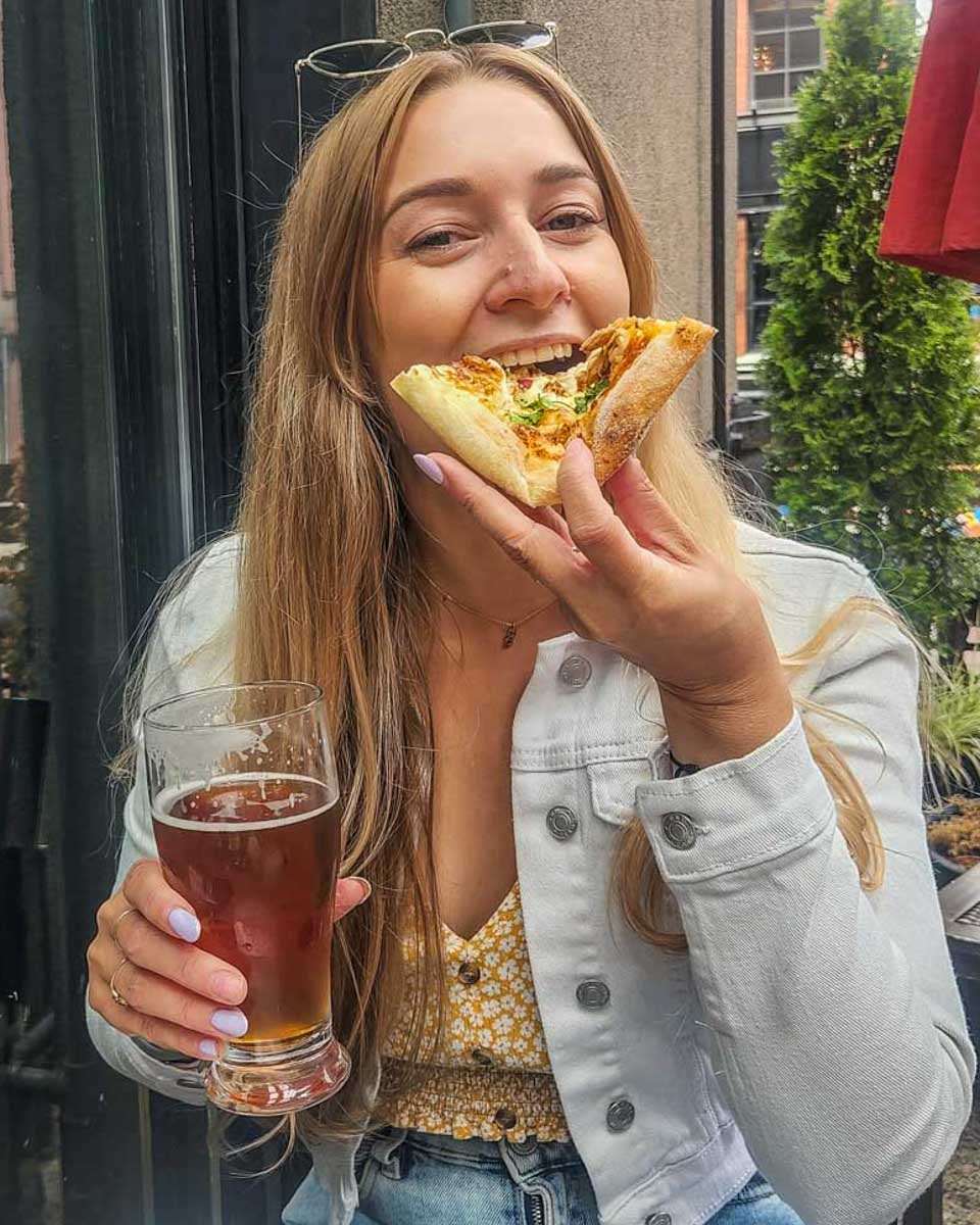 Bailey-eats-pizza-on-a-food-tour-in-Boston Massachusetts
