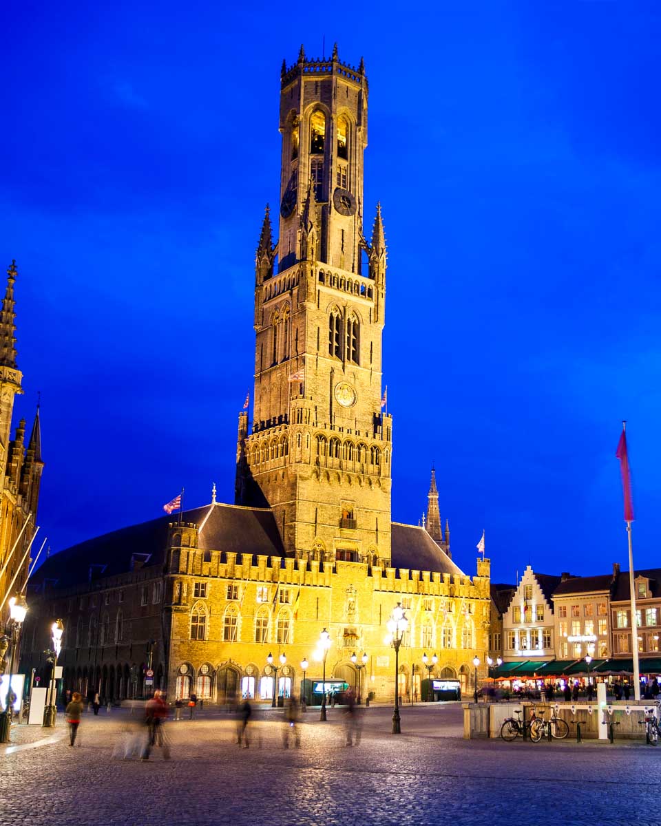 Belfry Belfort seen on a night walking tour in Bruges Belgium