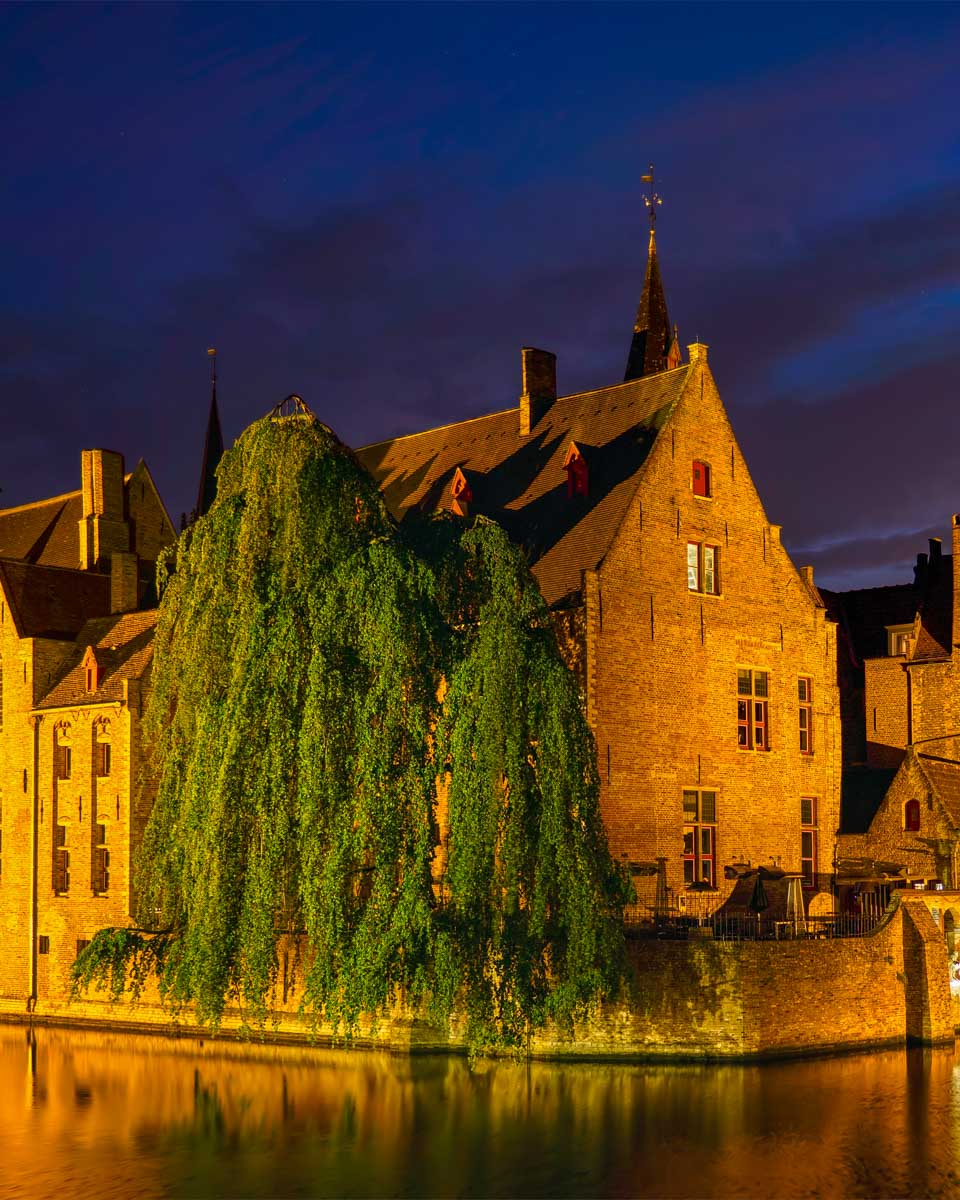 Bruges canal seen on a night walking tour in Belgium