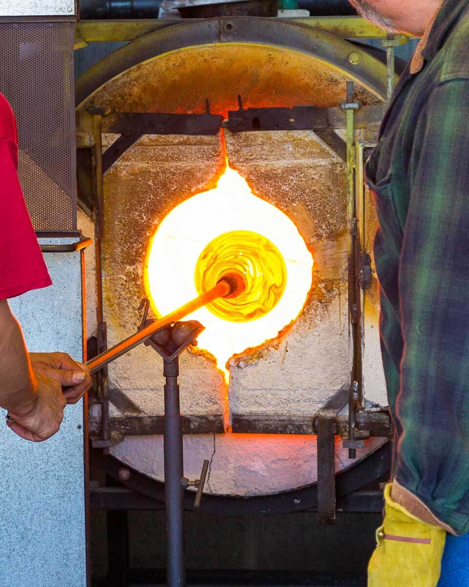 Men heat up glass at a glass blowing experience in Sedona Arizona