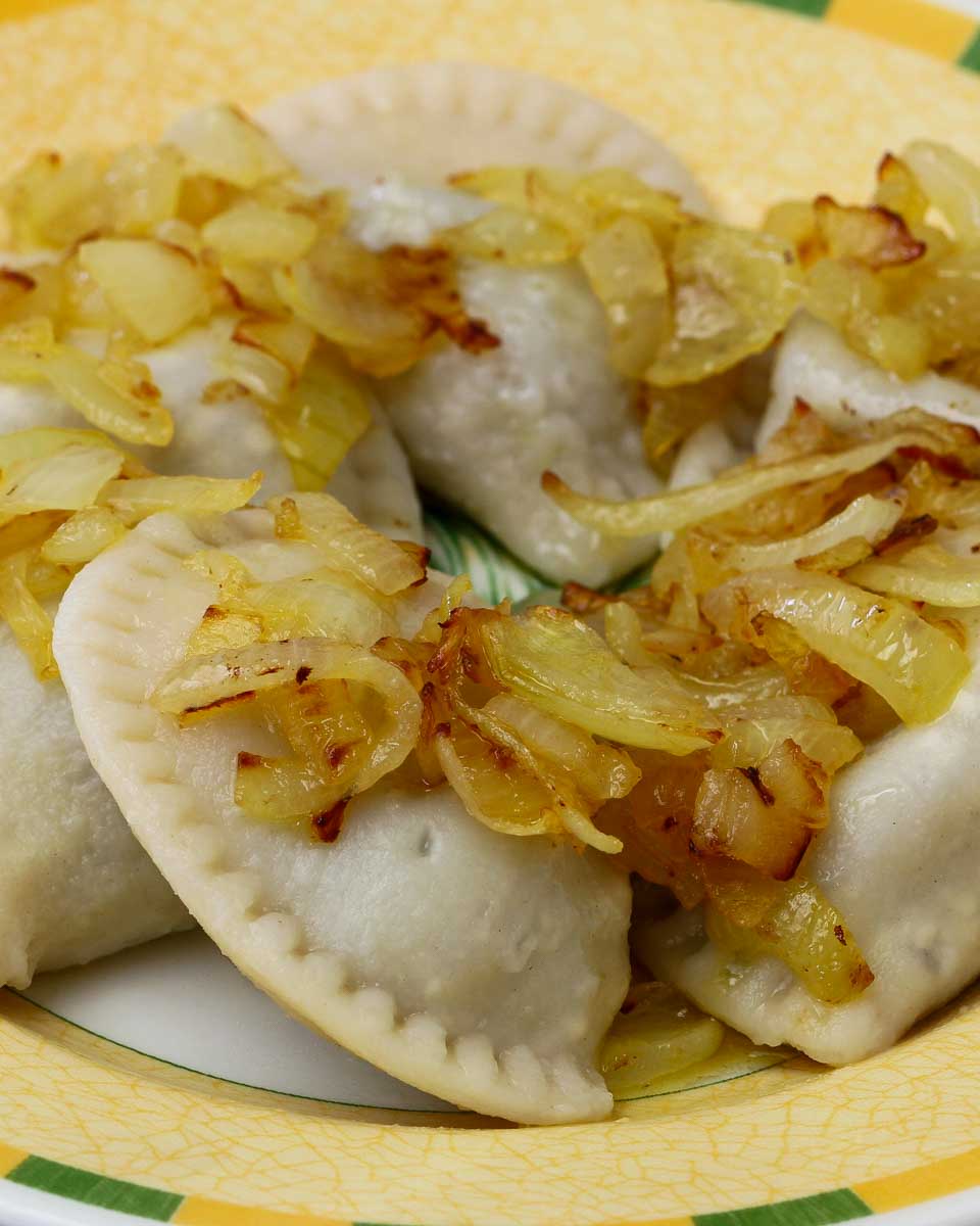 Polish-dumplings-garnished-with-fried-onions-on-a-food-tour-in-Warsaw-Poland