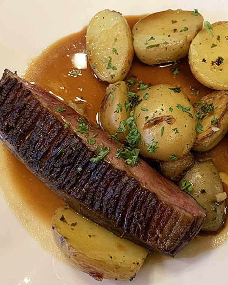Steak and potatoes at dinner at Hotel Le Relais Du Louvre Paris