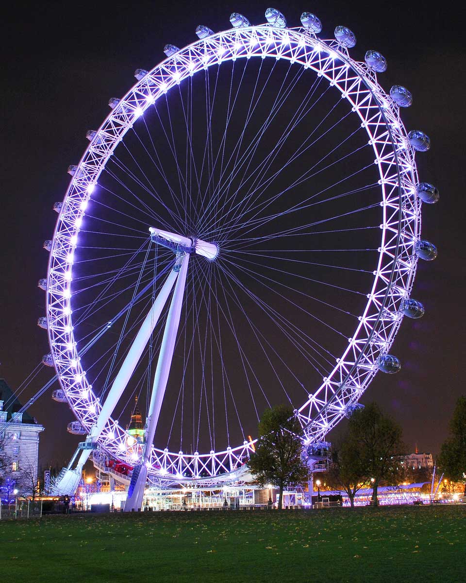 The London Eye at night seen in London England