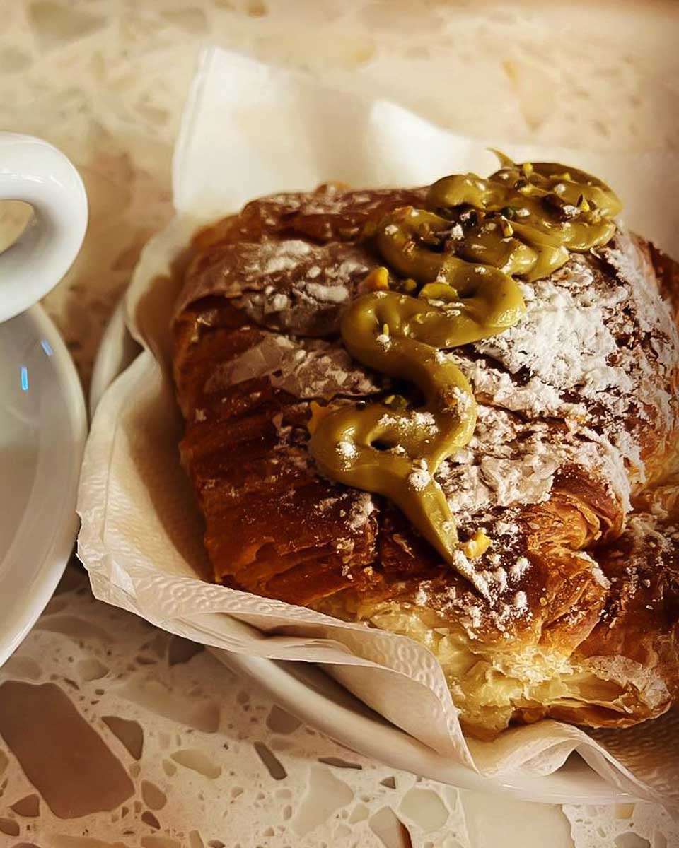 A cappuccino and cornetto at Mangia E Trevi Rome Italy