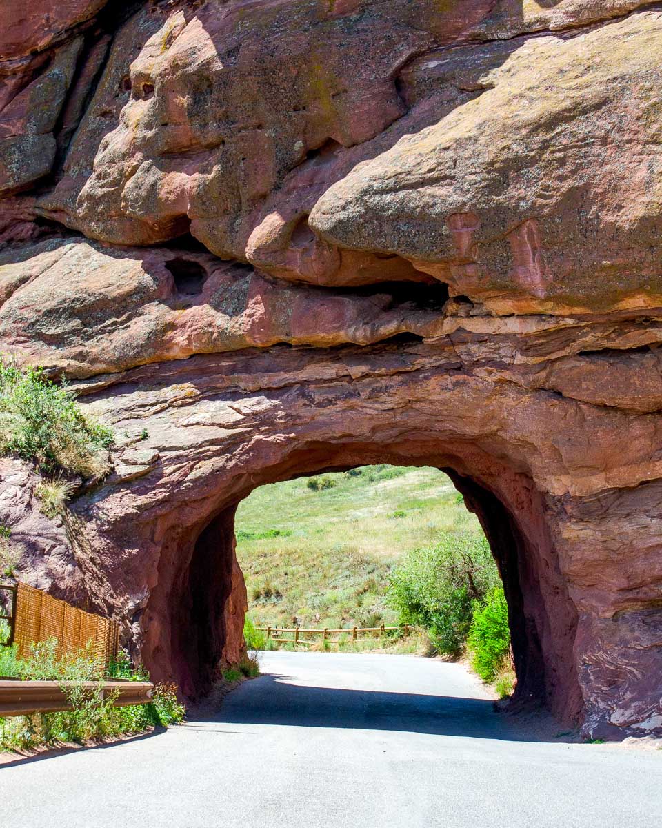 A hole in the tunnel to Red Rocks Park and Amphitheater on a tour from Denver Colorado