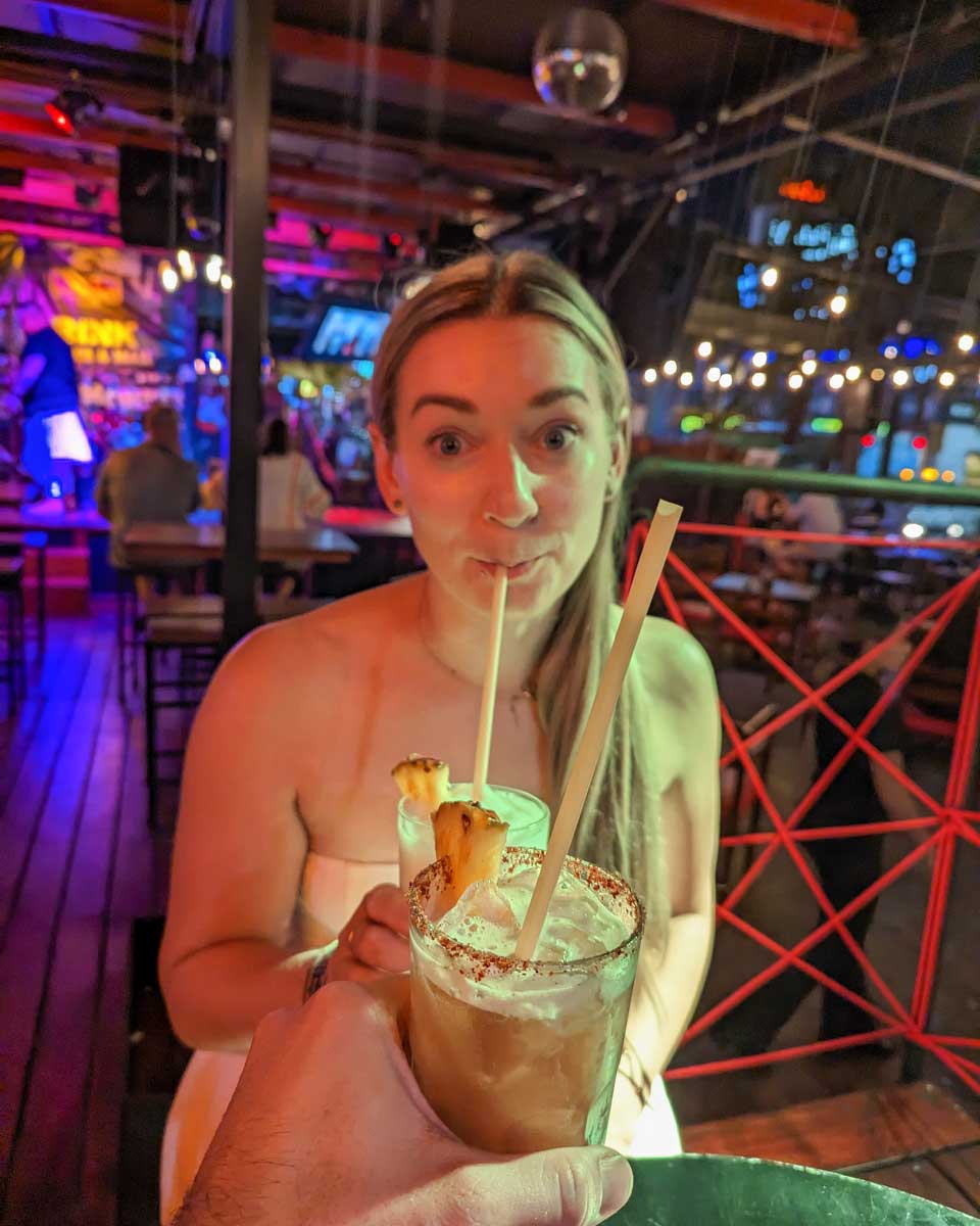 Bailey-drinks-a-cocktail-on-a-party-bike-pub-crawl-in-Key West Florida