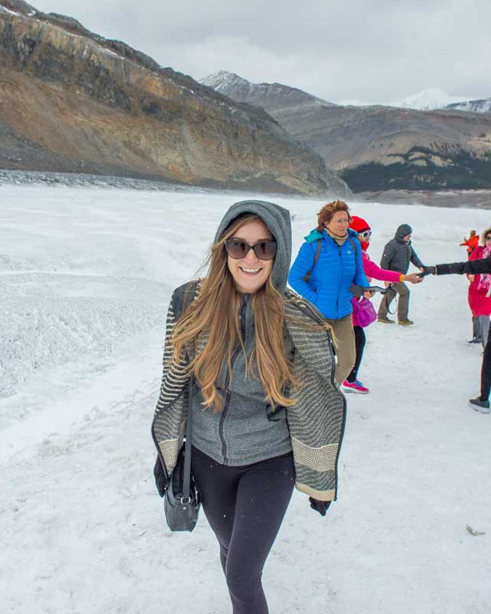 Bailey-smiles-at-the-camera-on-the-Athabasca-Glacier-on-a-Columbia-Icefield-Adventure-Canada