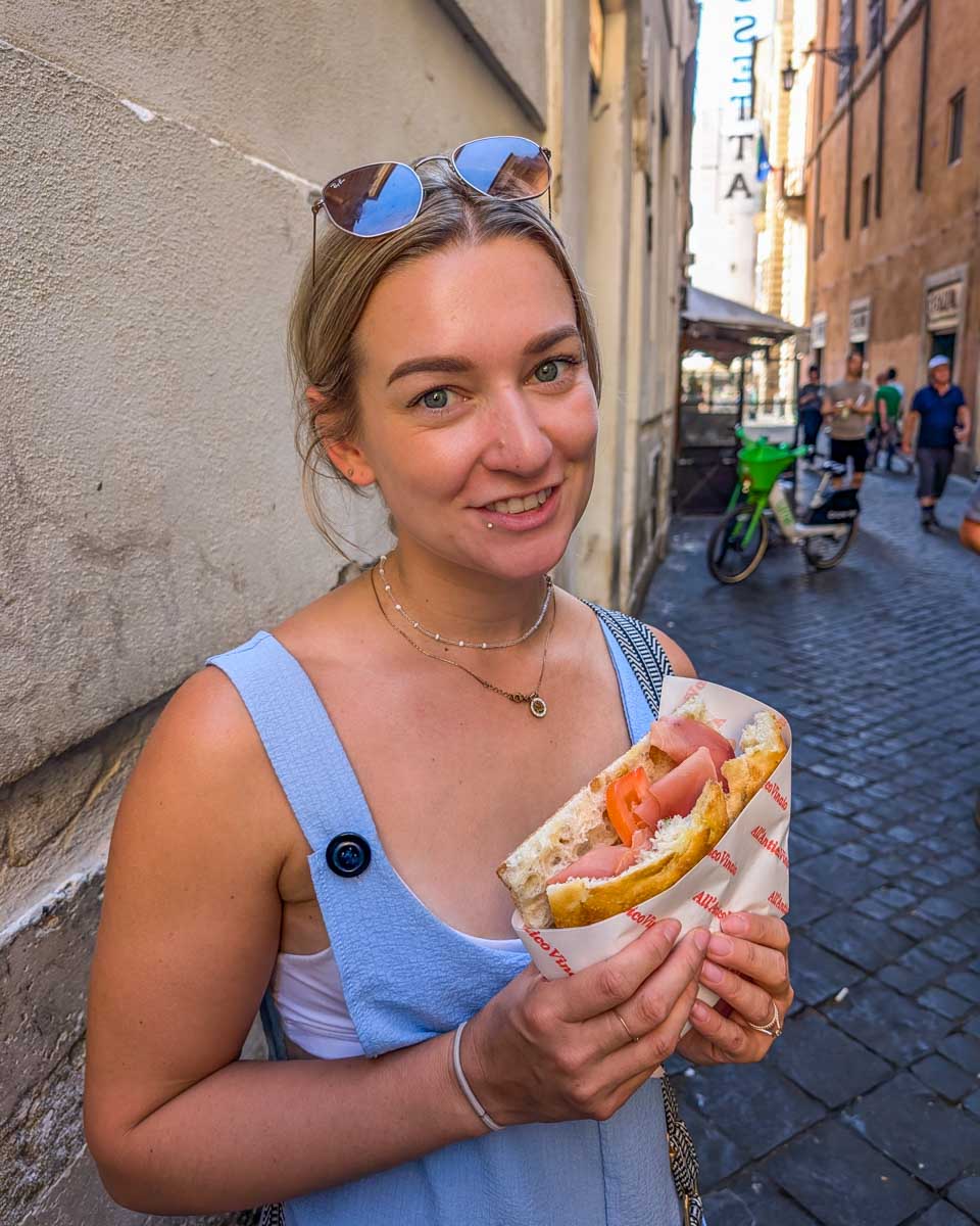 Bailey-with-a-sandwich-on a food tour in Nice France