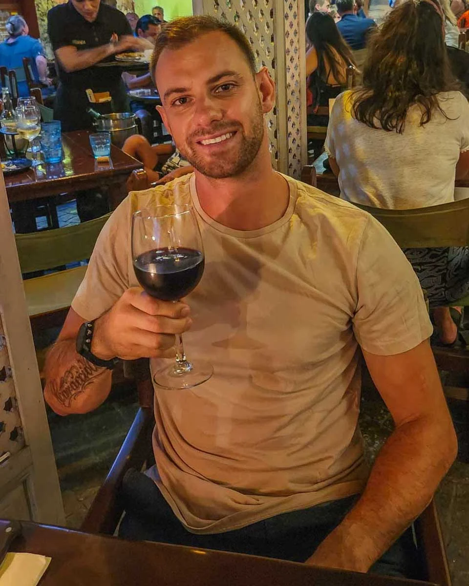 Daniel-enjoys-a-glass-of-wine-during-dinner-in-Madrid