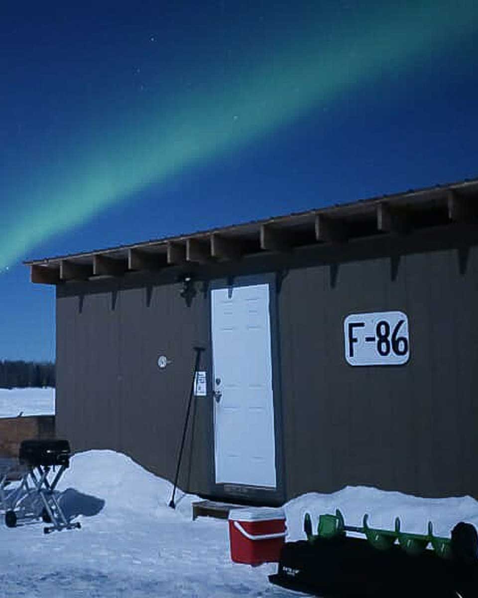 Rod's Alaskan Guide Service northern lights seen while ice fishing on a tour from Fairbanks Alaska