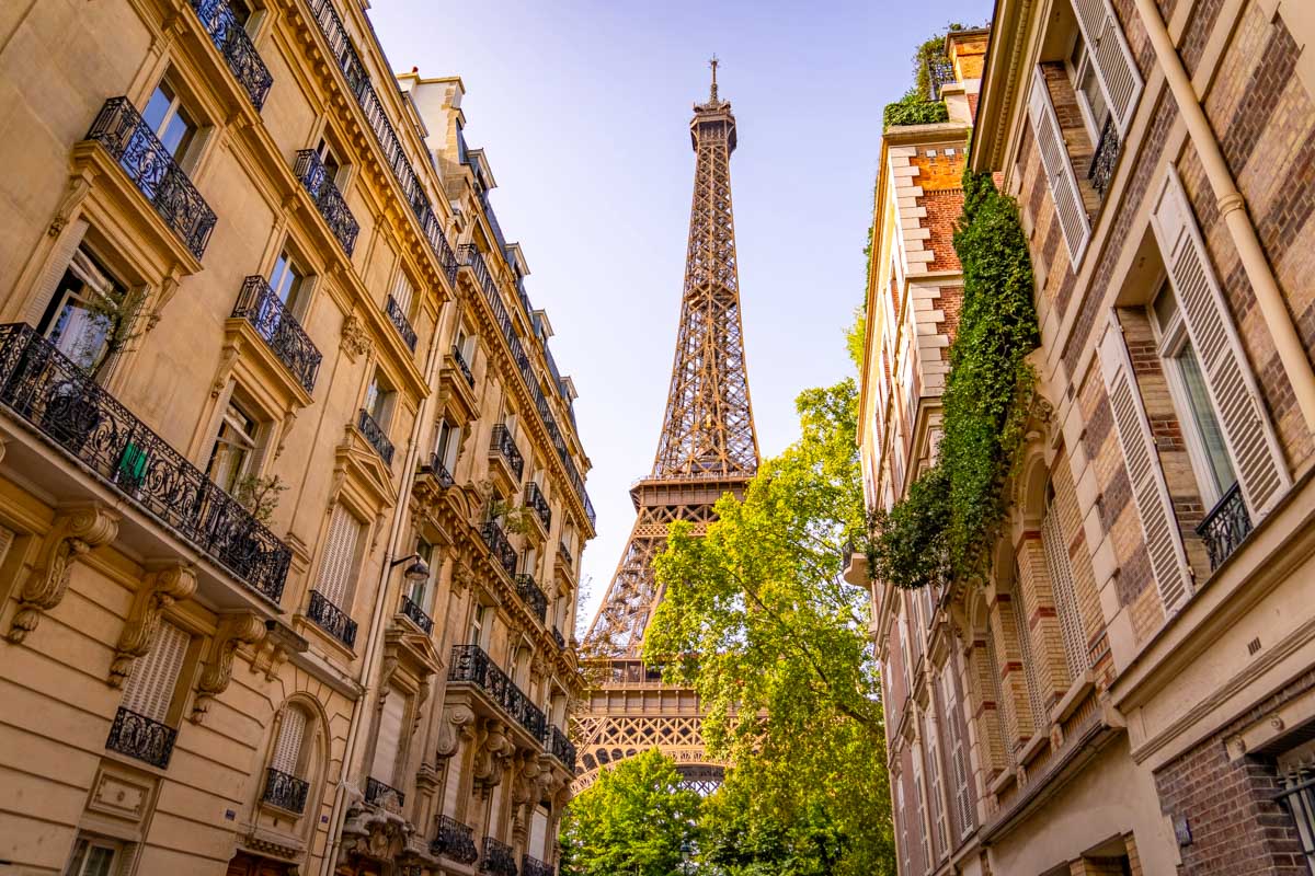 The view of Eiffel Tower seen from the streets of Paris France