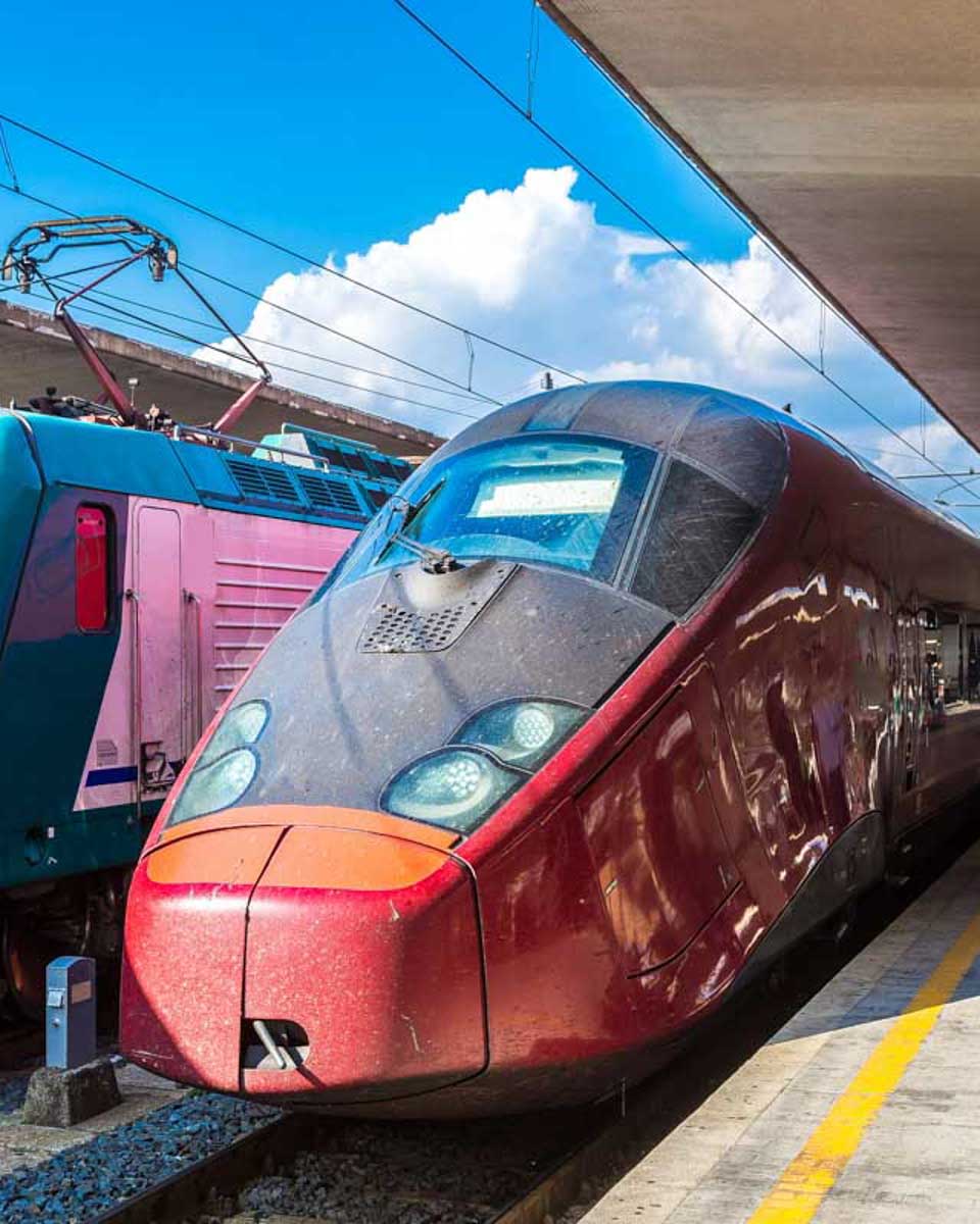 Two-trains-at-the-Santa-Maria-Novella-station-in-Florence-Italy