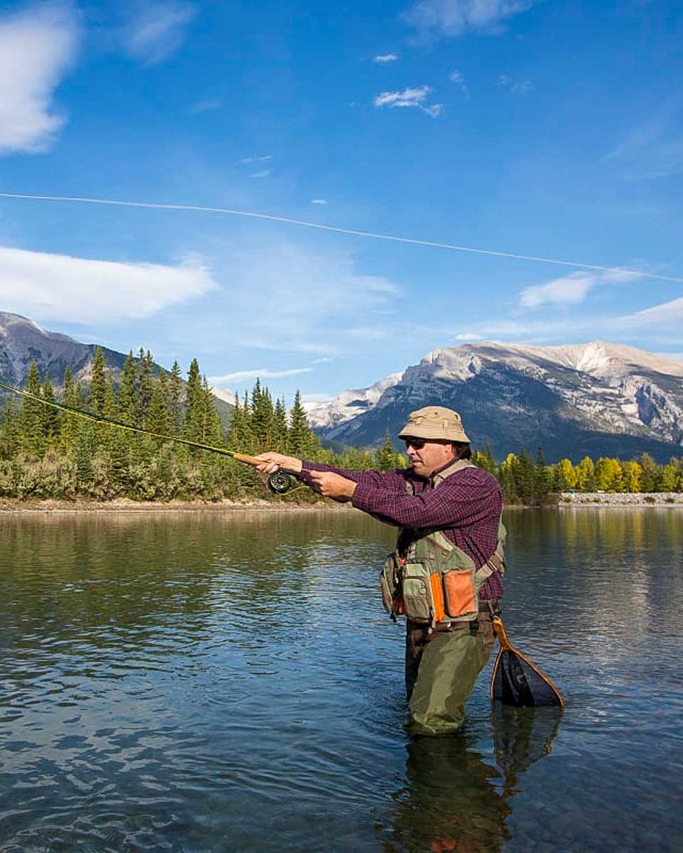 man-fly-fishing-in Jackson Hole Wyoming
