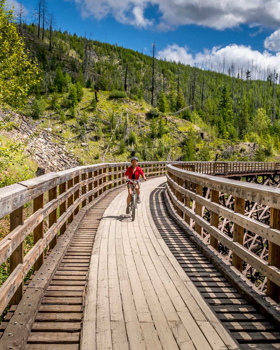 A person bikes Kettle Valley Railway on a tour from Kelowna to Penticton BC