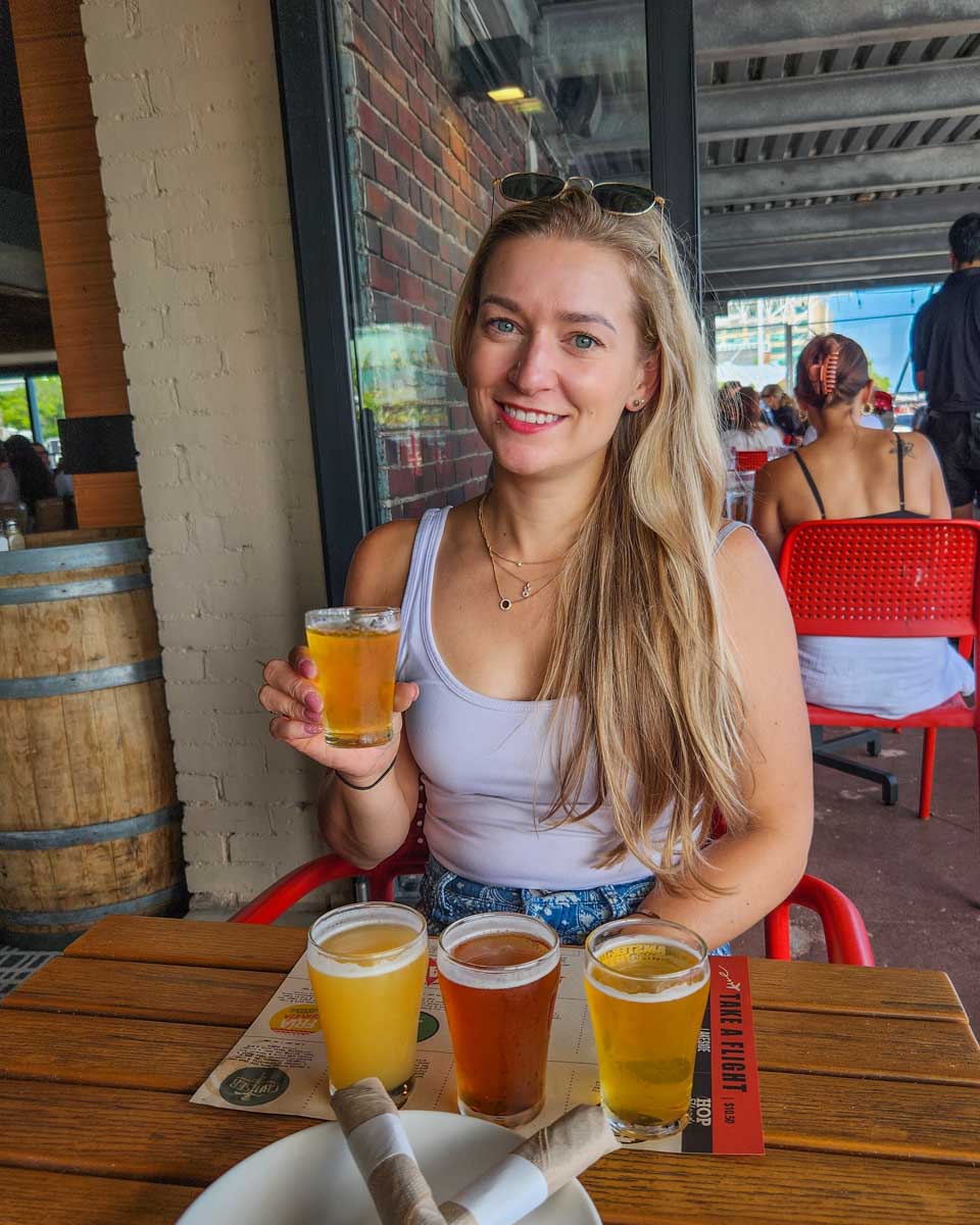 Bailey-drinks-craft-beer-at-Harpoon-Brewery-in-Charlotte North Carolina