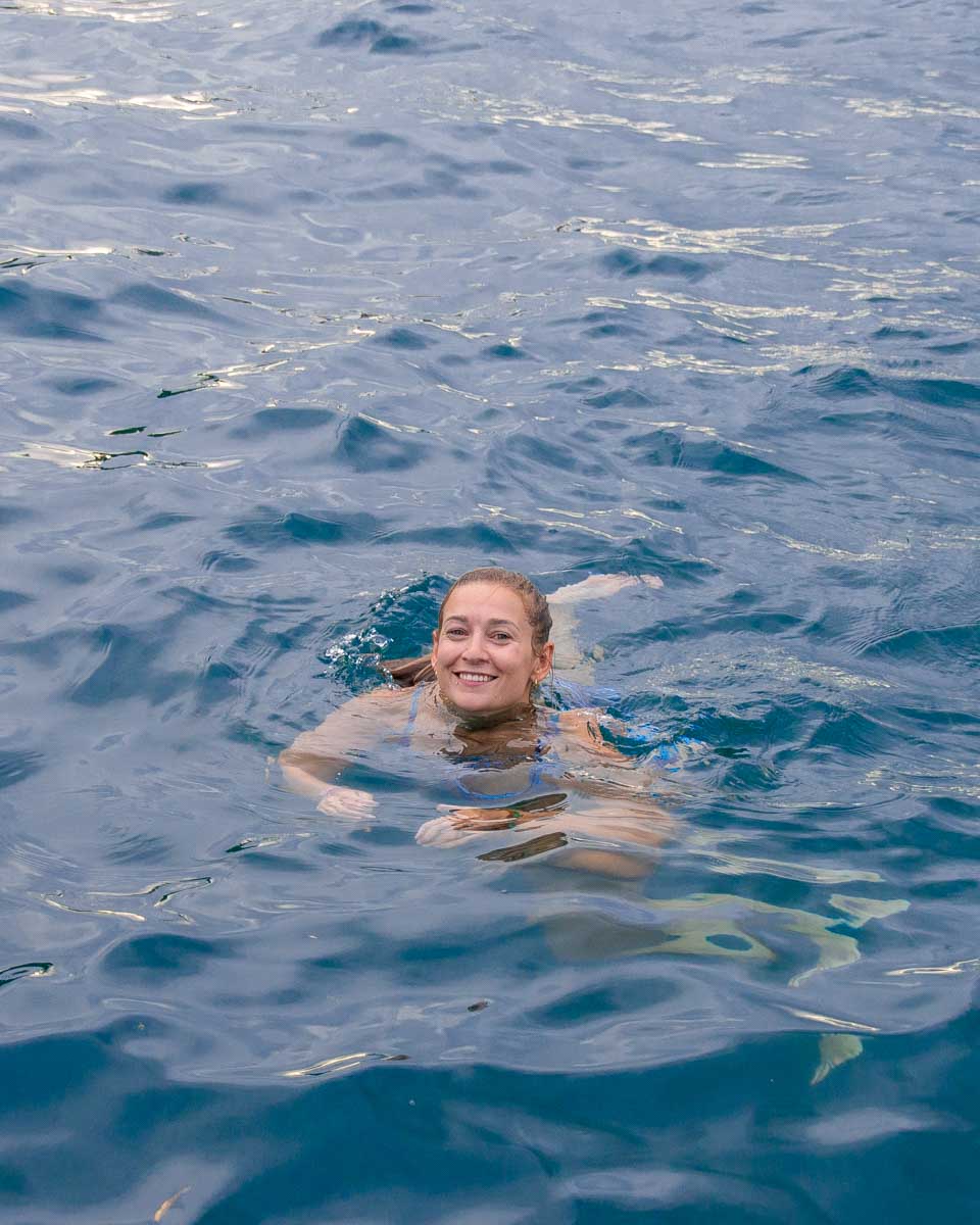Bailey-swims-in Ammoudi Bay Santorini Greece