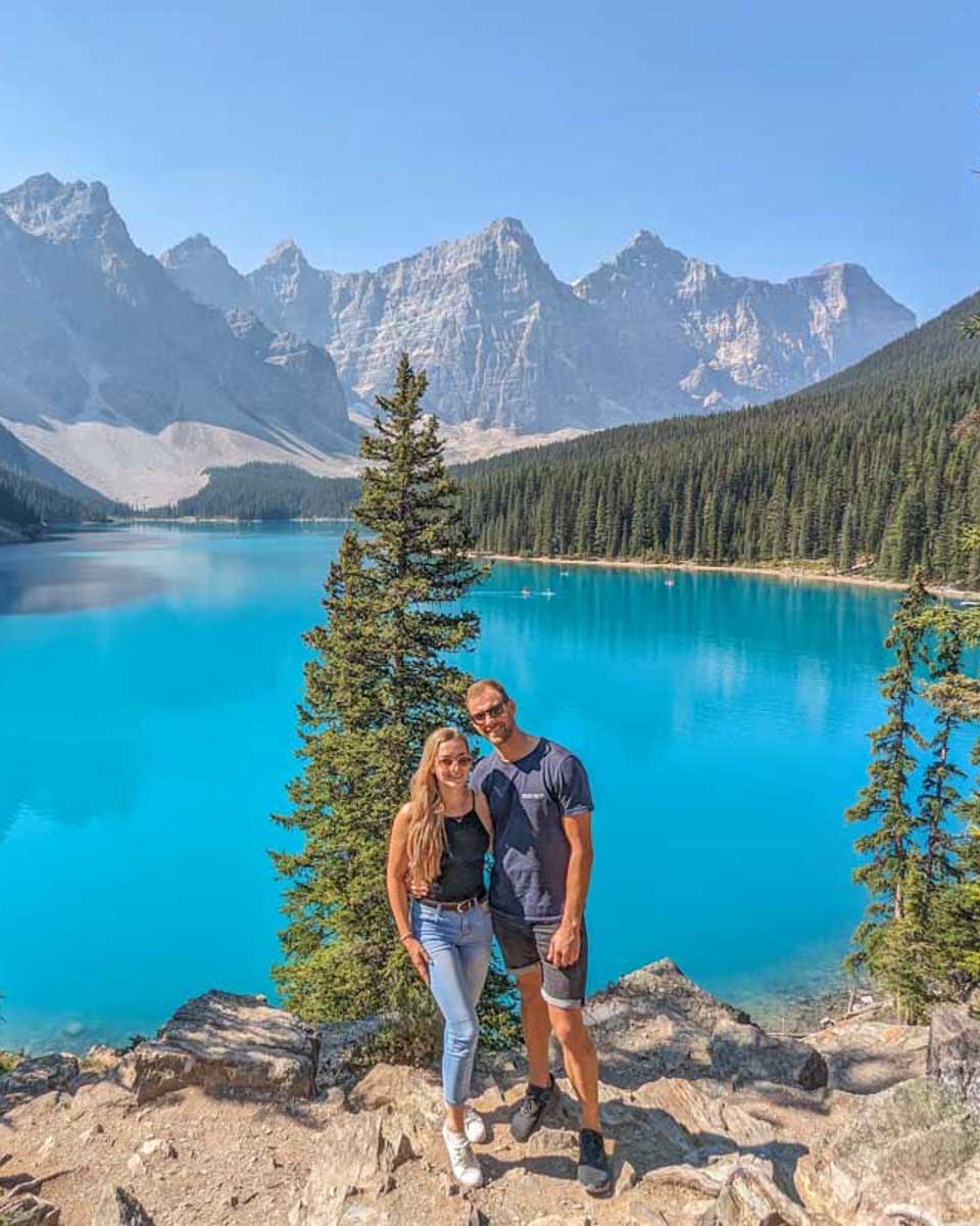 Daniel-and-Bailey-pose-for-a-photo-the-the-rockpile-at-Moraine-Lake on an icefields parkway tour