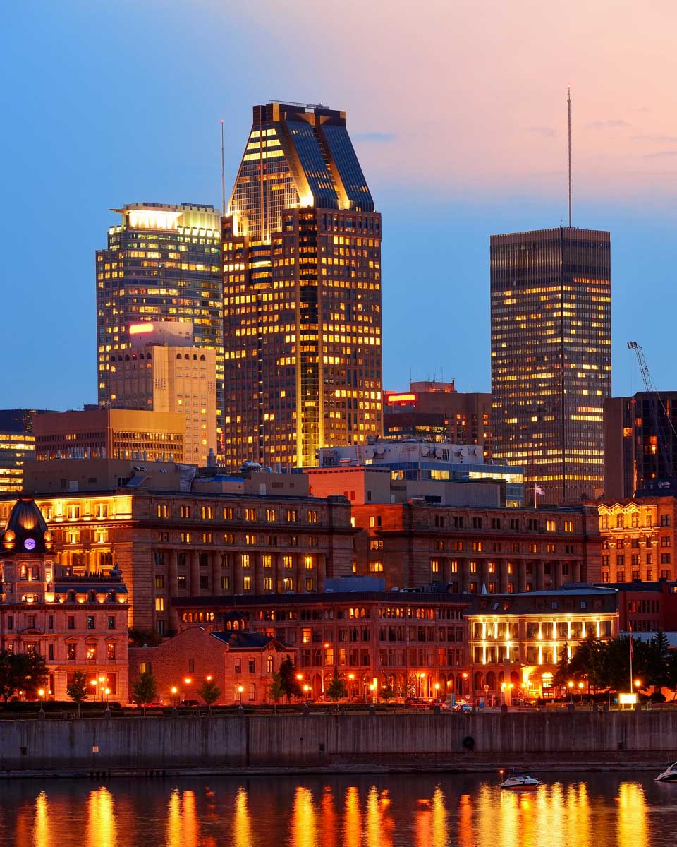 Montreal skyline seen at sunset on a river cruise in Montreal Quebec