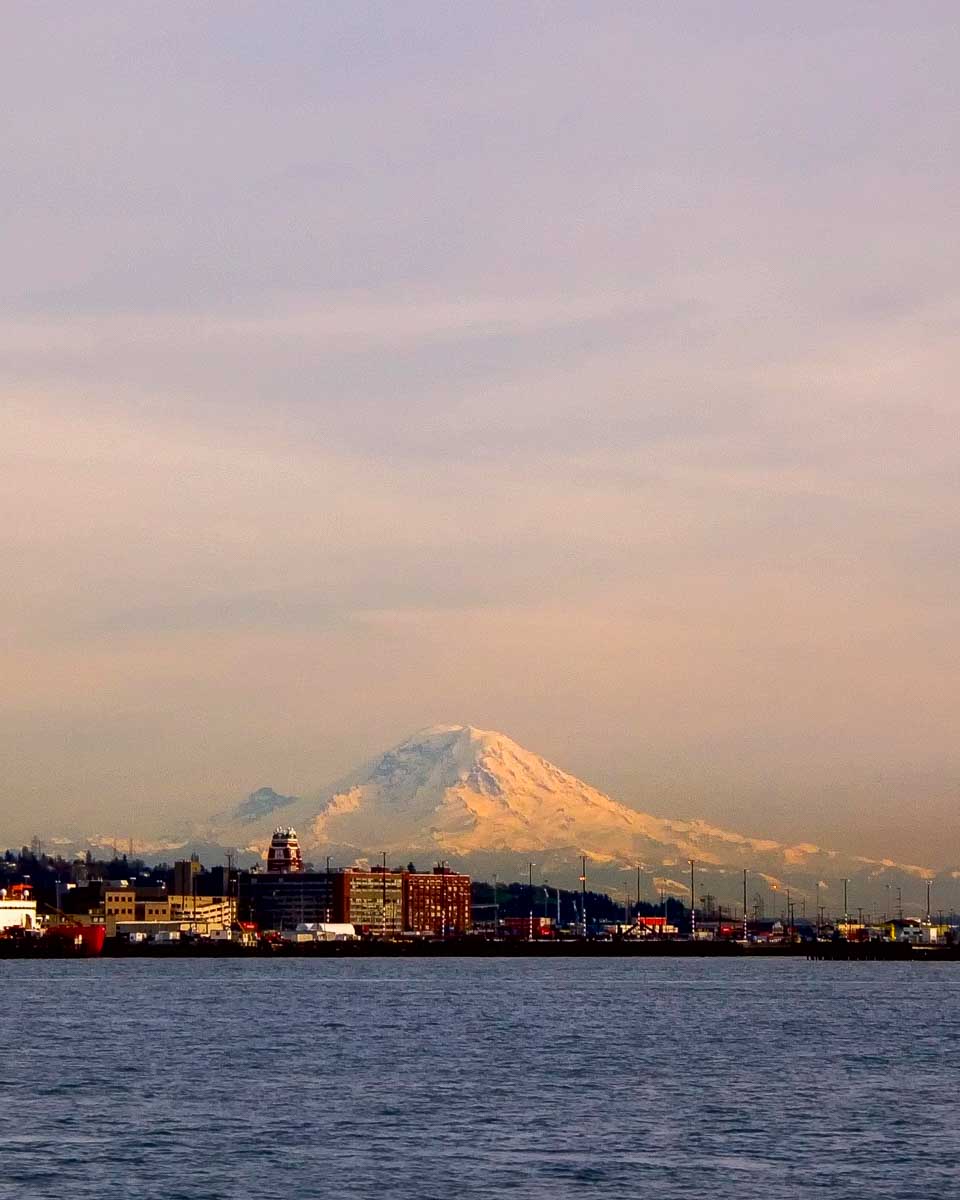 Mount Rainier seen at sunset on a sailboat tour from Seattle Washington