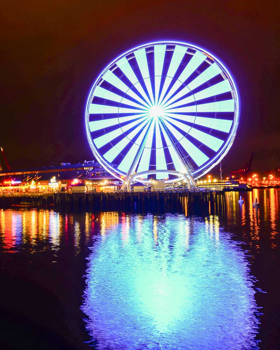 The Seattle Great Wheel seen at night on a sunset sailing tour Seattle Washington