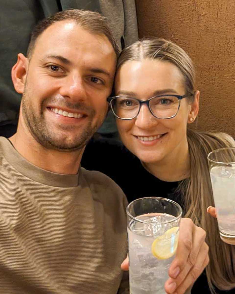 Bailey-and-Daniel-take-a-selfie-while-holding-drinks-on-a-night-tour-in-Seoul-South-Korea