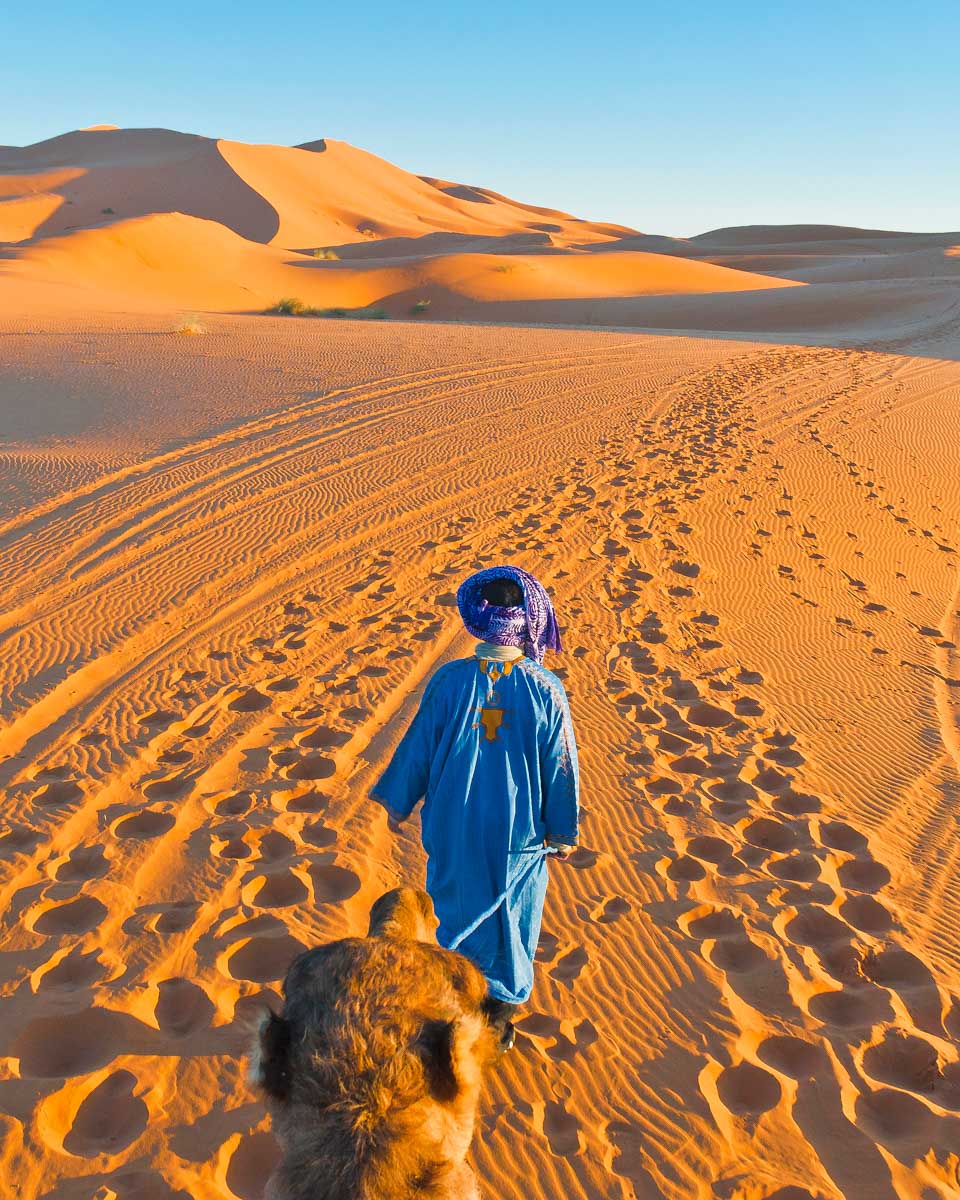 Riding-a-camel-through-the-AgafayDesert-in-Merzouga on a tour from Marrakech Morocco