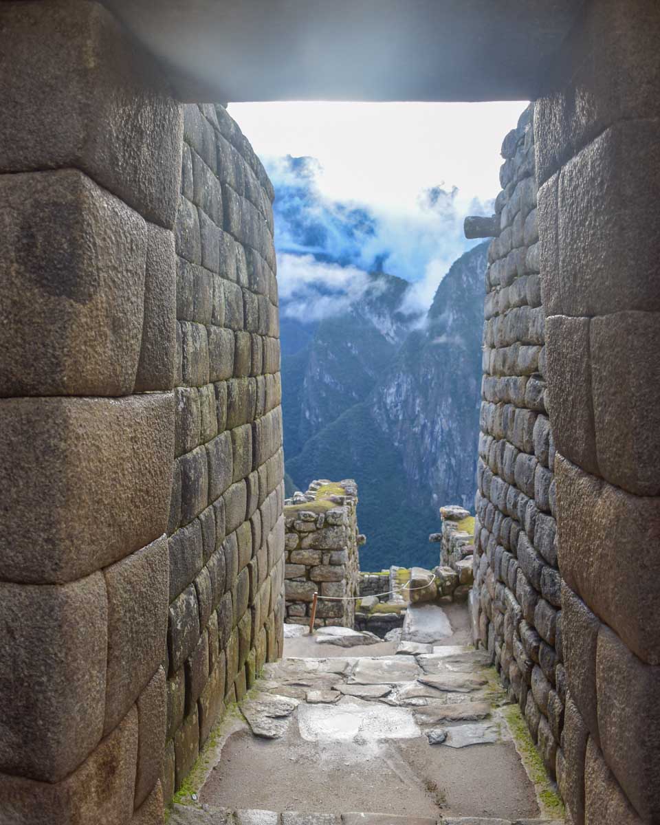View-through-a-thin-hallway-at-Machu-Picchu on a tour from Cusco Peru