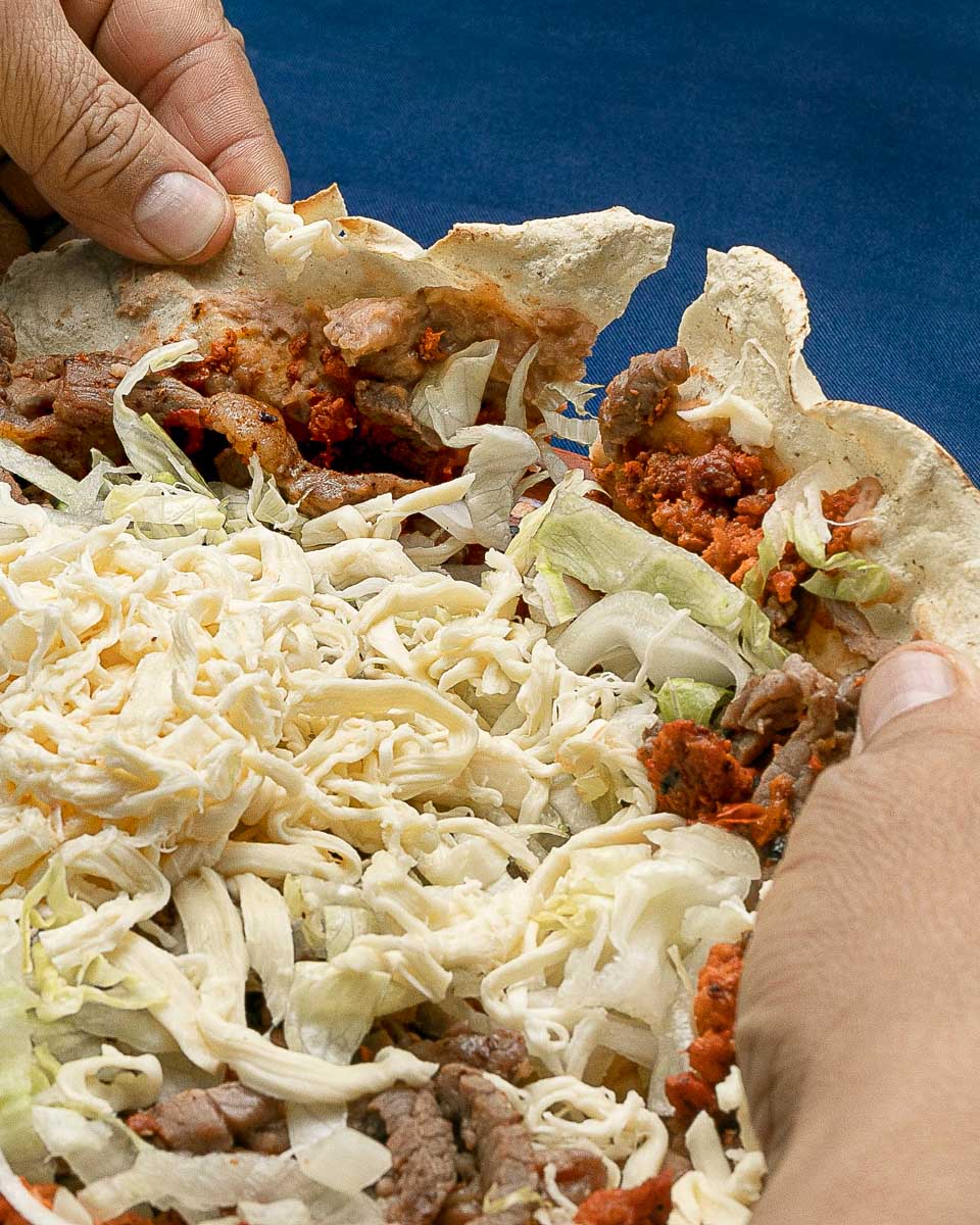 A tlayuda eaten on a food tour in Oaxaca City Mexico