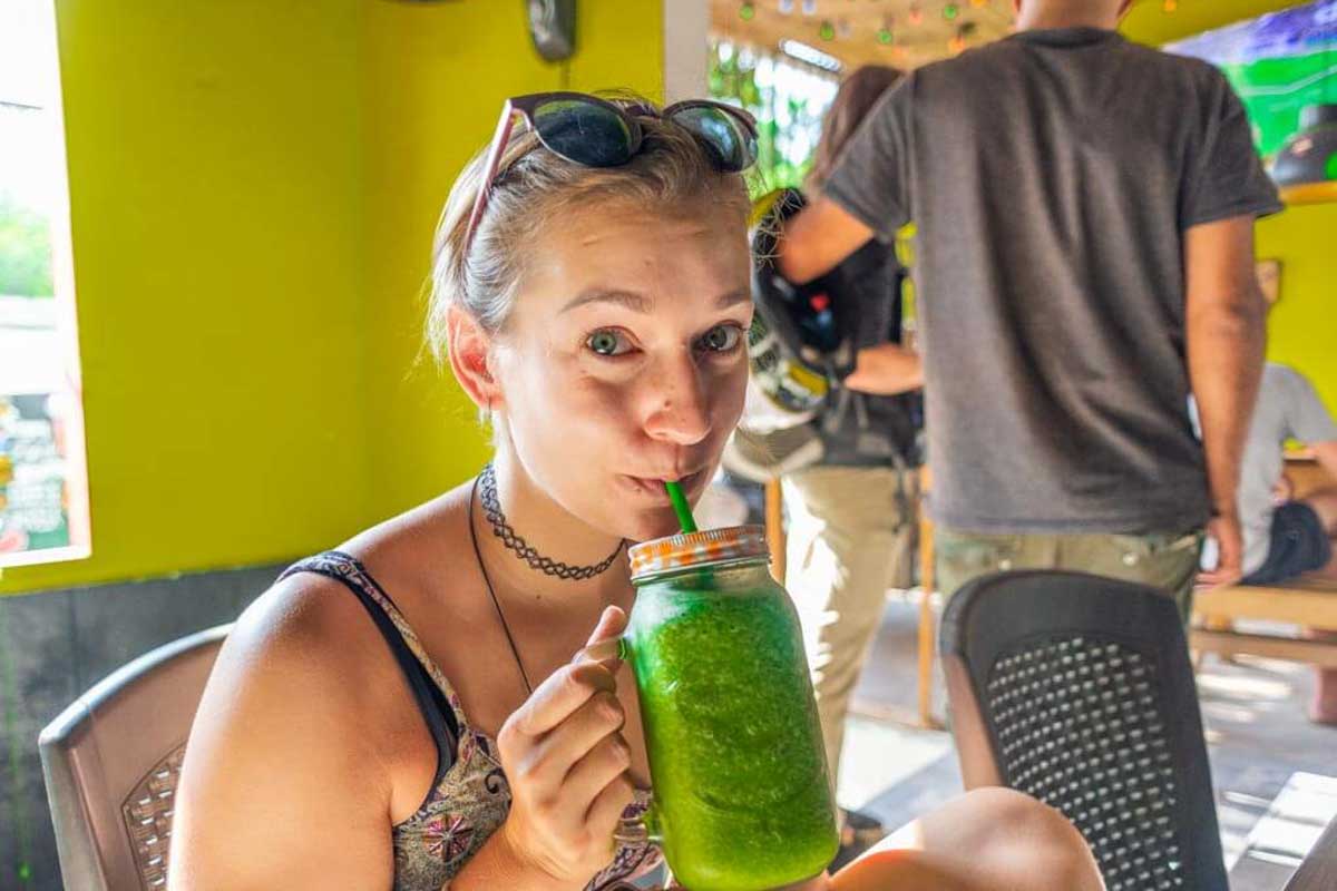 Bailey drinks a smoothie for breakfast in Tulum Mexico